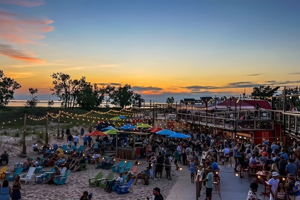 Grab food and drinks right on the sand at The Deck - Muskegon’s favorite beachside hangout