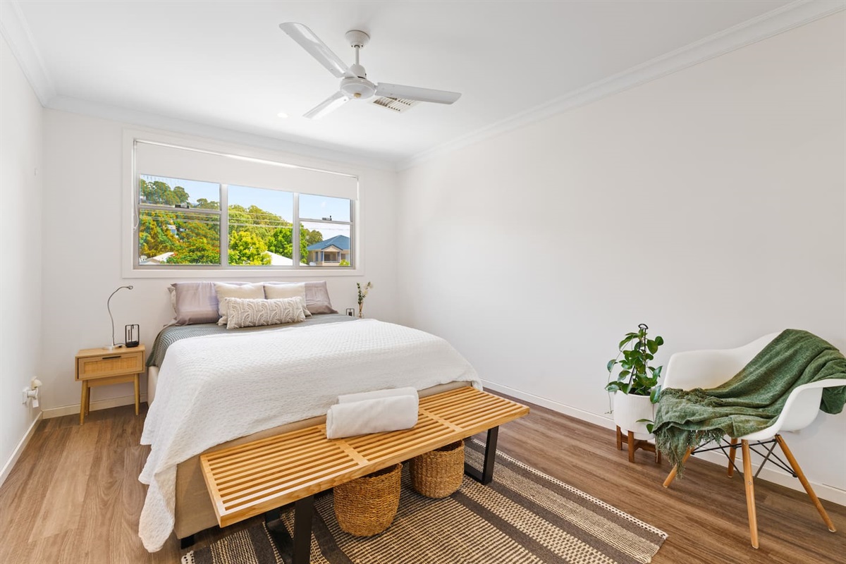 Bedroom 2 with ample storage and a quiet outlook