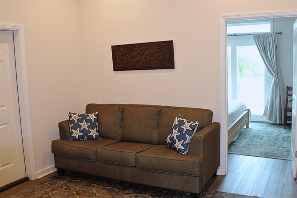Foyer: Bright and airy entryway with stylish decor and an inviting sleeper sofa are warm welcomes!