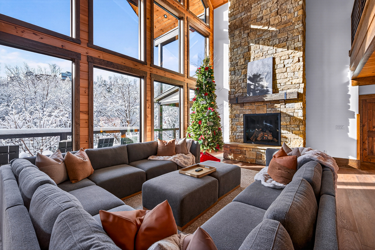 Gather around the twinkling Christmas tree and enjoy the warmth of the Smokies. This inviting living space is the perfect backdrop for holiday memories, family traditions, and cozy winter evenings.