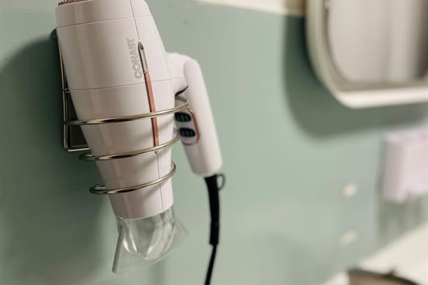 A hair dryer is thoughtfully provided, adding convenience and ease to your morning routine.