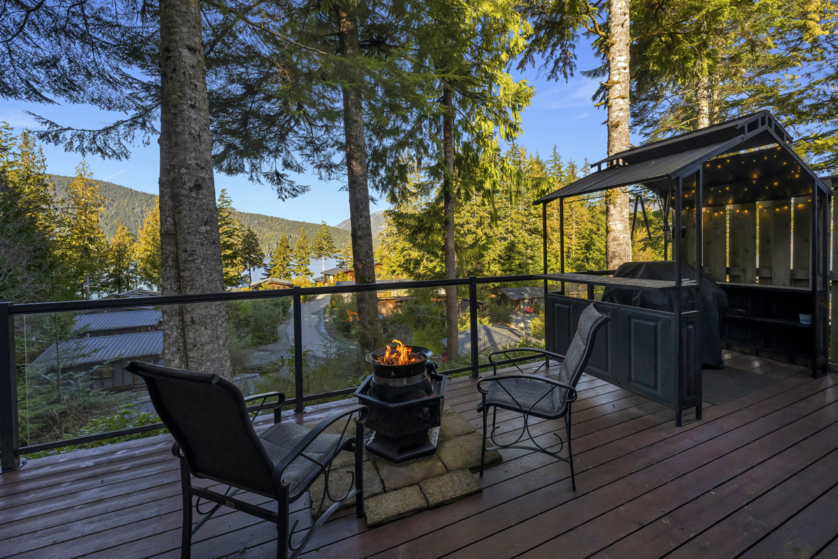 Propane fire pit and the covered BBQ area