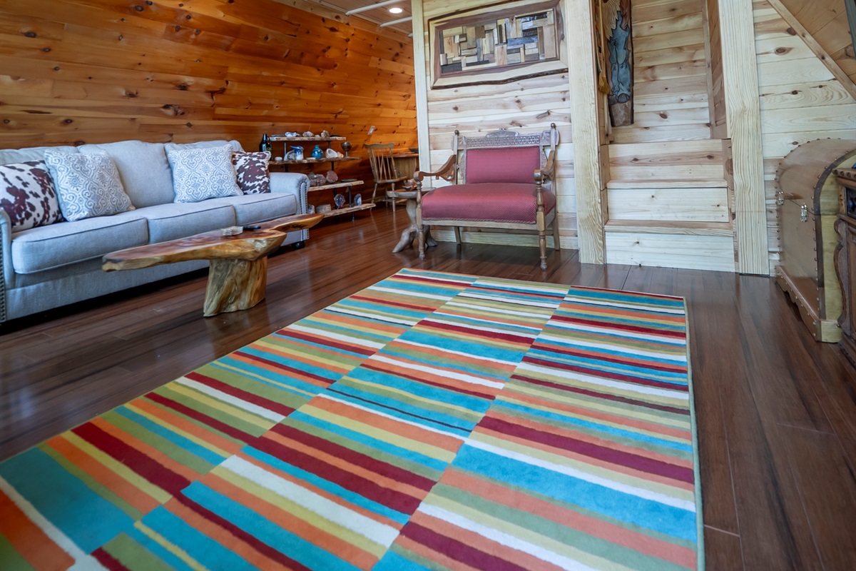 Relax, unwind, and take in the view—this inviting space blends comfort, natural light, and Laurel Cove’s unique character.