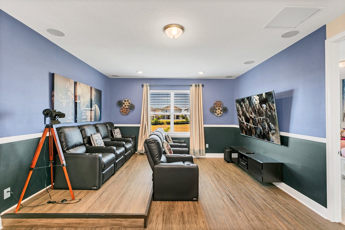 Whether you're watching the latest blockbusters, watching your favorite shows, or enjoying family-friendly films, this spacious room offers the perfect setting featuring a large 85-inch flat-s