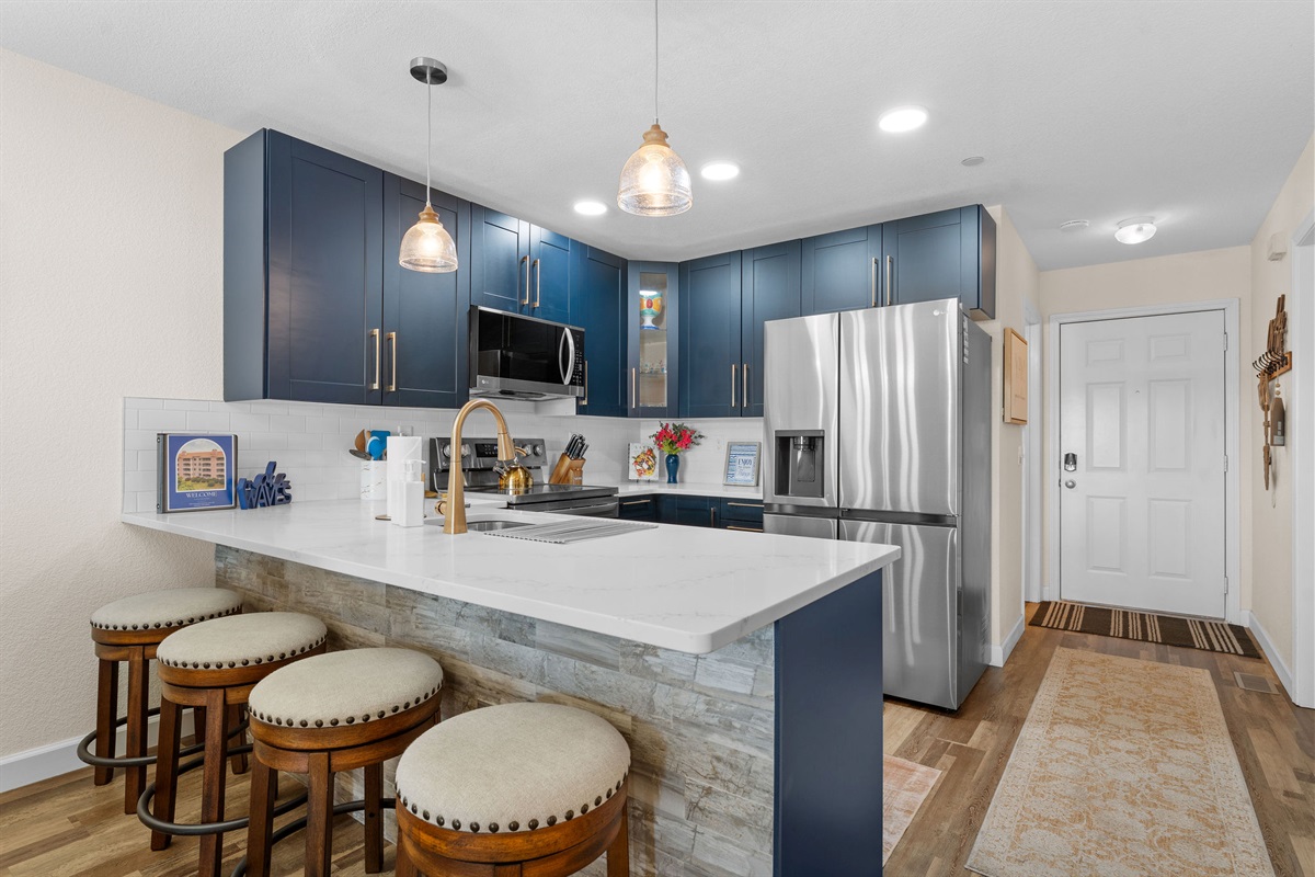 Spacious island with bar seating, perfect for gathering.