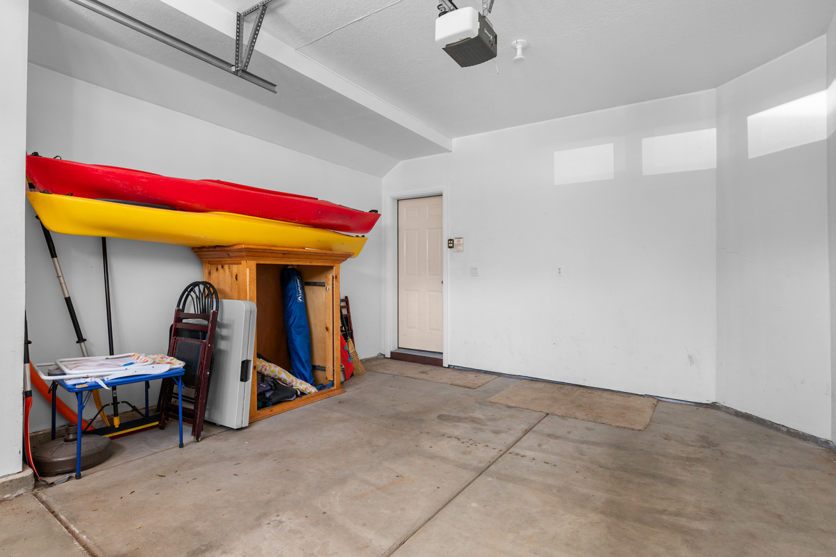 Attached garage provides convenient parking and storage for outdoor gear.