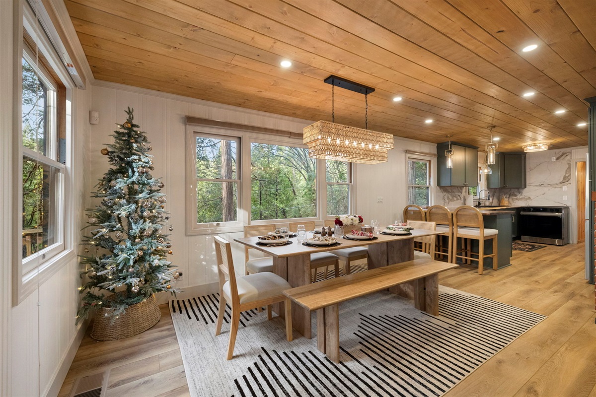 Open concept living at its finest. The dining room is centrally located between the living room and kitchen with beautiful views from every seat.