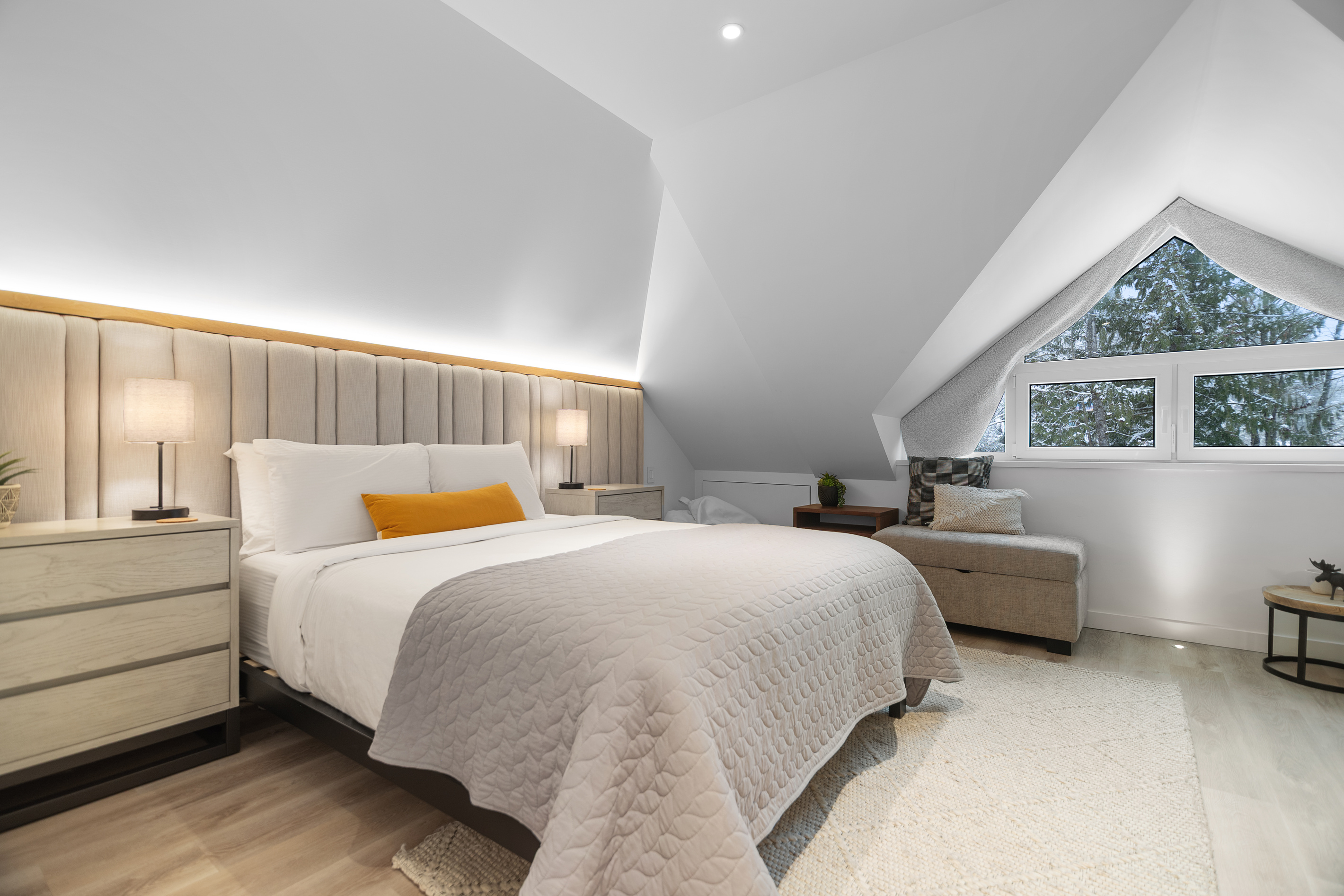 Top-floor primary bedroom with queen bed