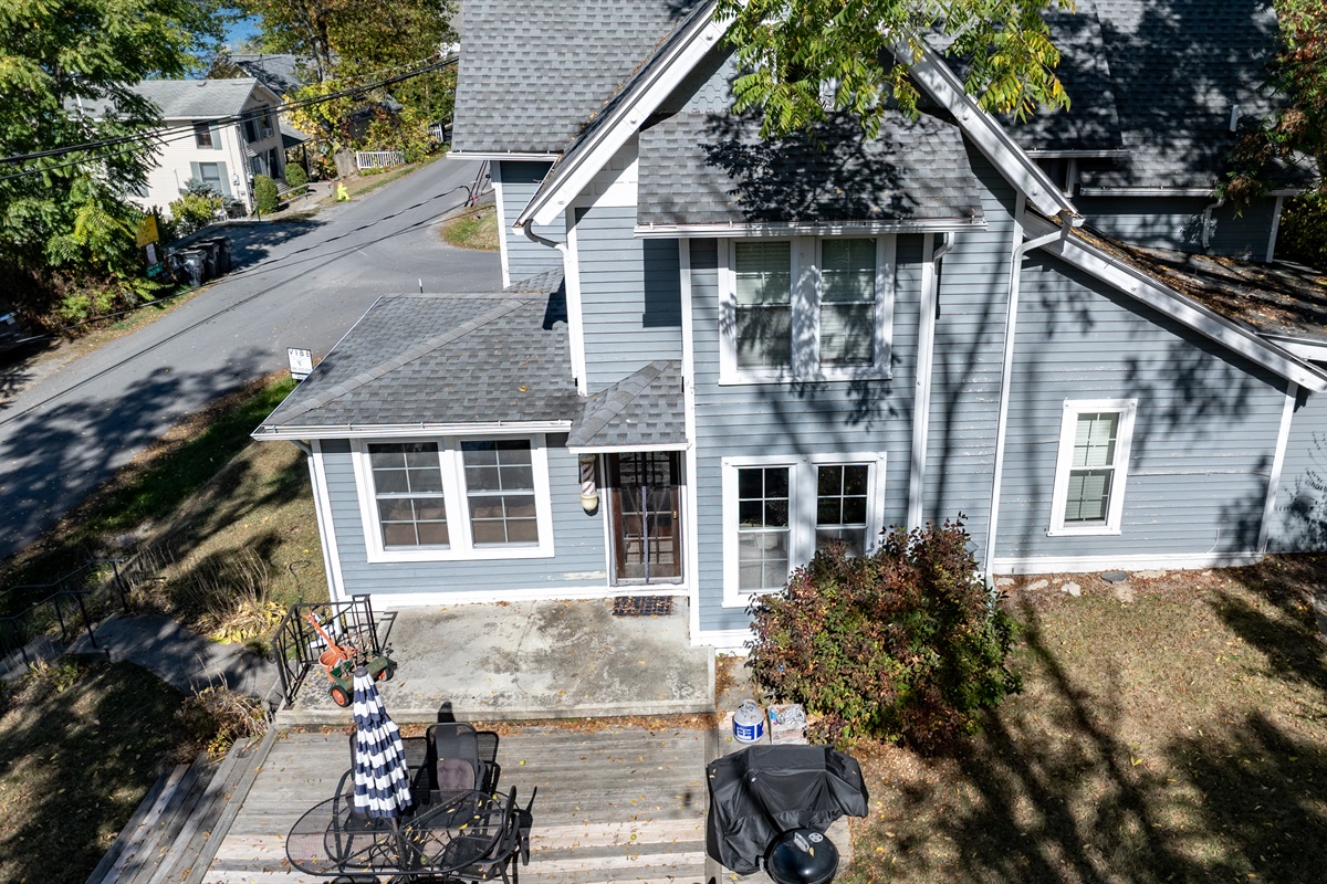 Charming lake-view home with modern farmhouse design and inviting curb appeal — your cozy getaway awaits