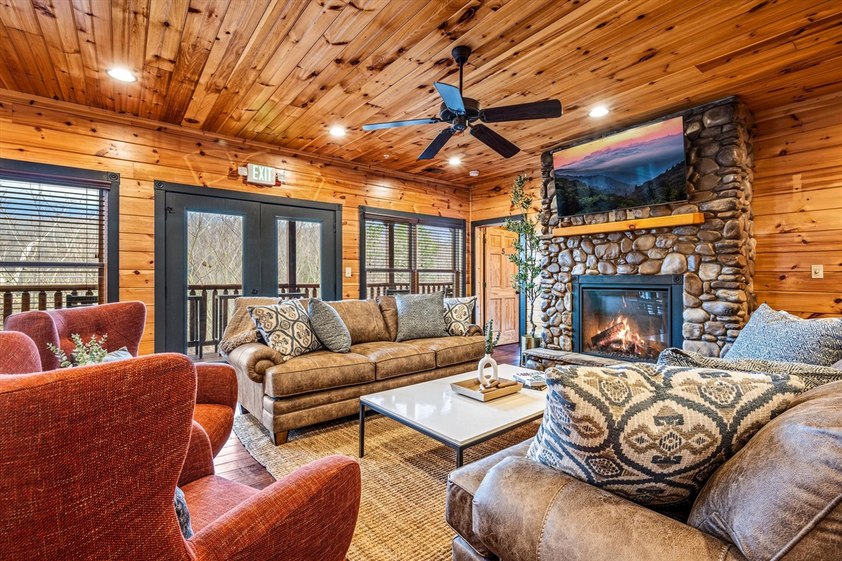 The family room has a fireplace and views of the mountains.