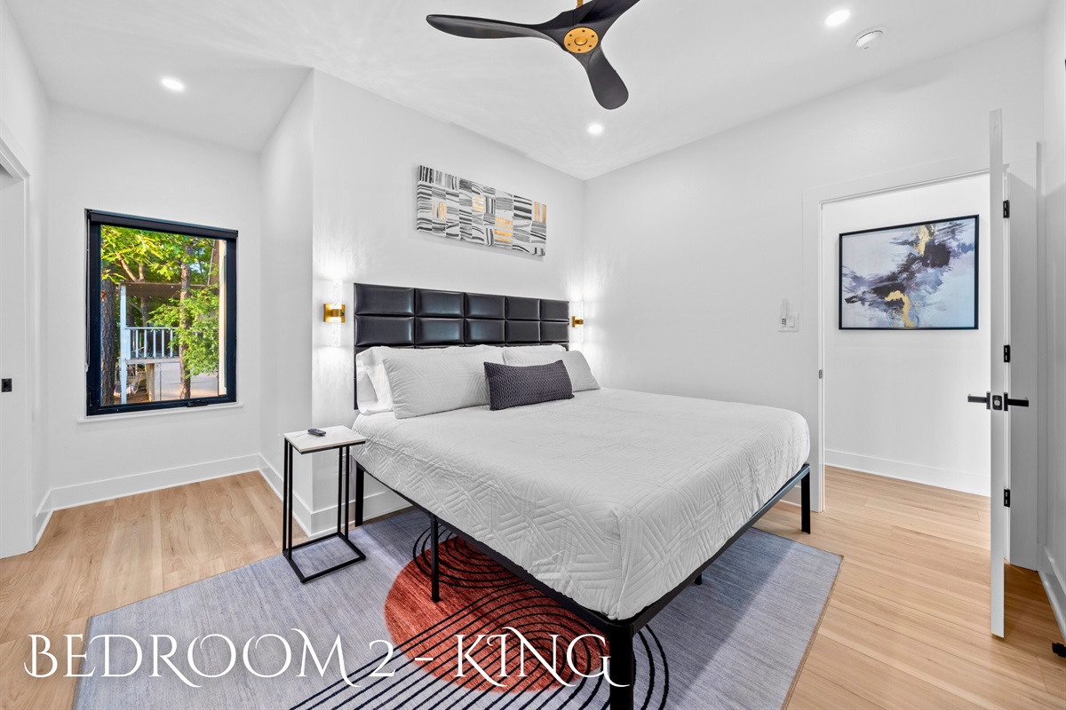 Relax in luxury with this spacious bedroom. Comfort and elegance in every detail.