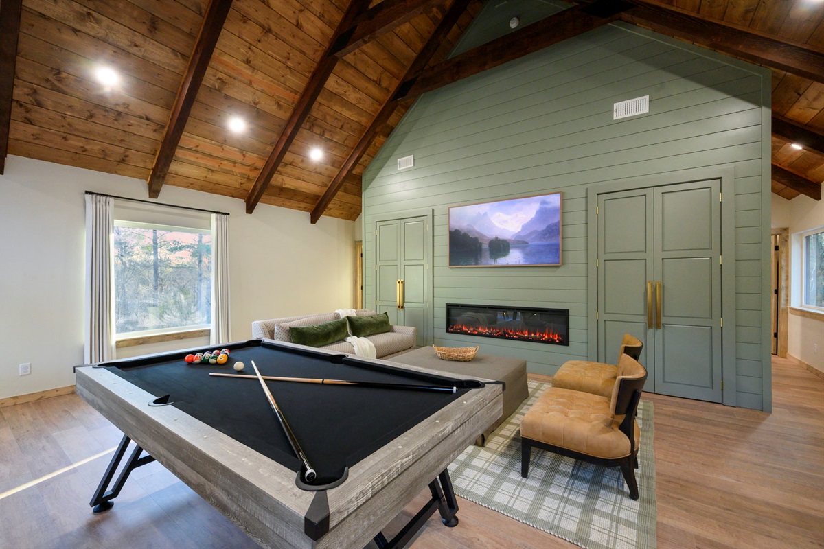 Cozy seating area with electric fireplace and TV &mdash; perfect for movie nights 🎬