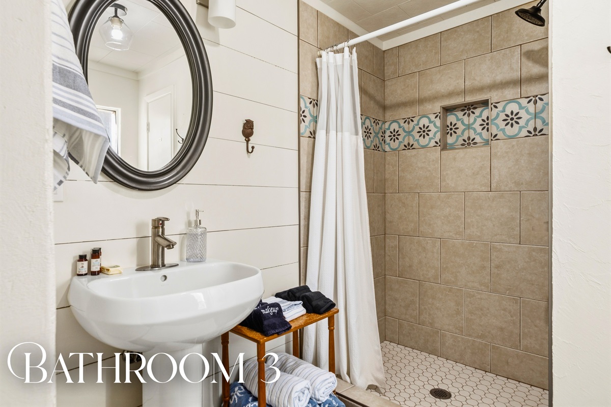 Refresh in this bathroom where modern finishes, a well-lit vanity, and a spacious shower come together for a comfortable and functional space.