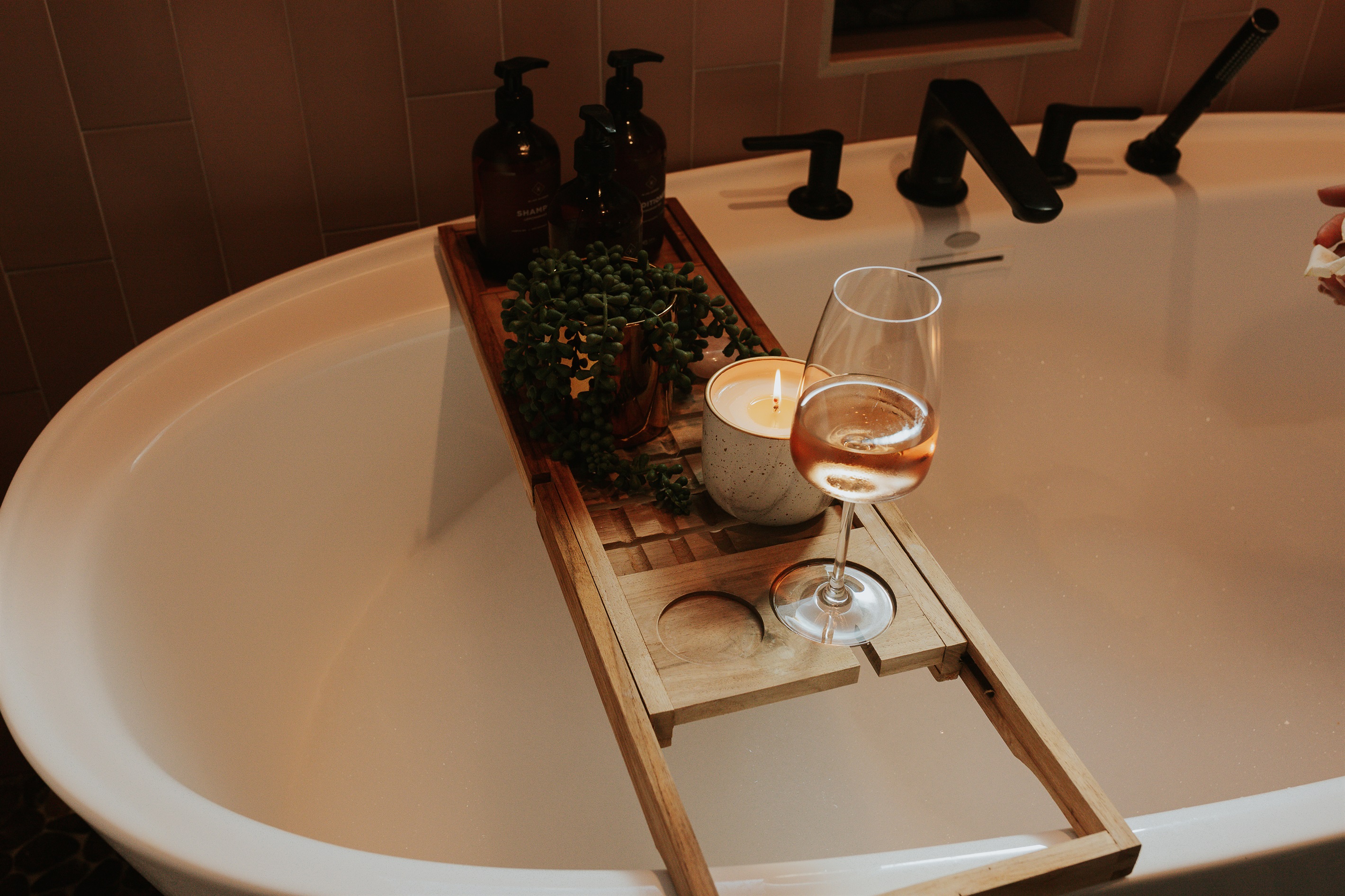 {Bath 1} Enjoy a soak in the standalone tub with a glass of complimentary wine and lush toiletries.