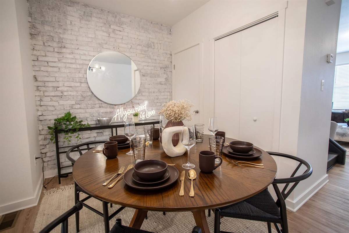Charming 4-seater dining area, designed with a cozy ambiance, perfect for enjoying meals or casual gatherings in a warm and inviting setting.