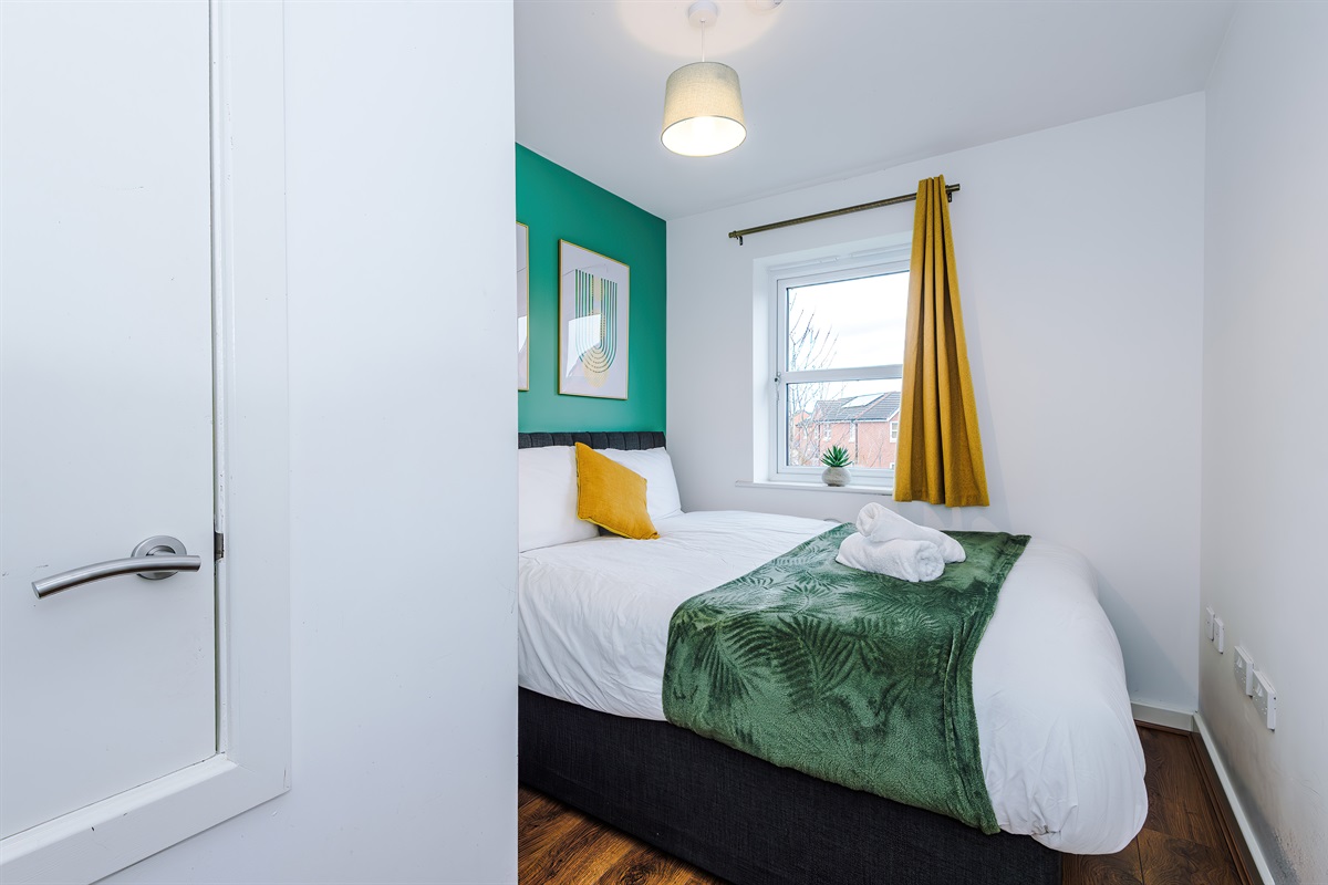 Bedroom 1 benefits from a hotel comfort king bed which can be arranged into 2 singles