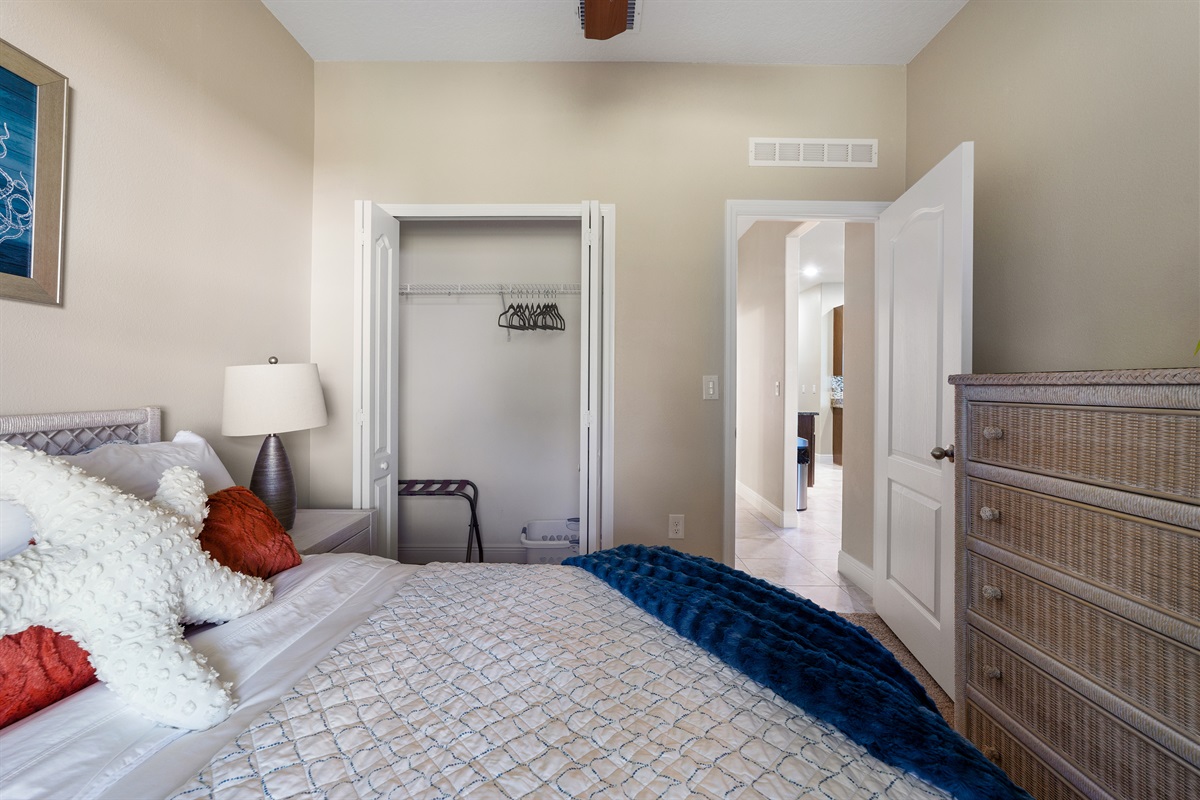 Full Bedroom 1 with chest of drawers and closet