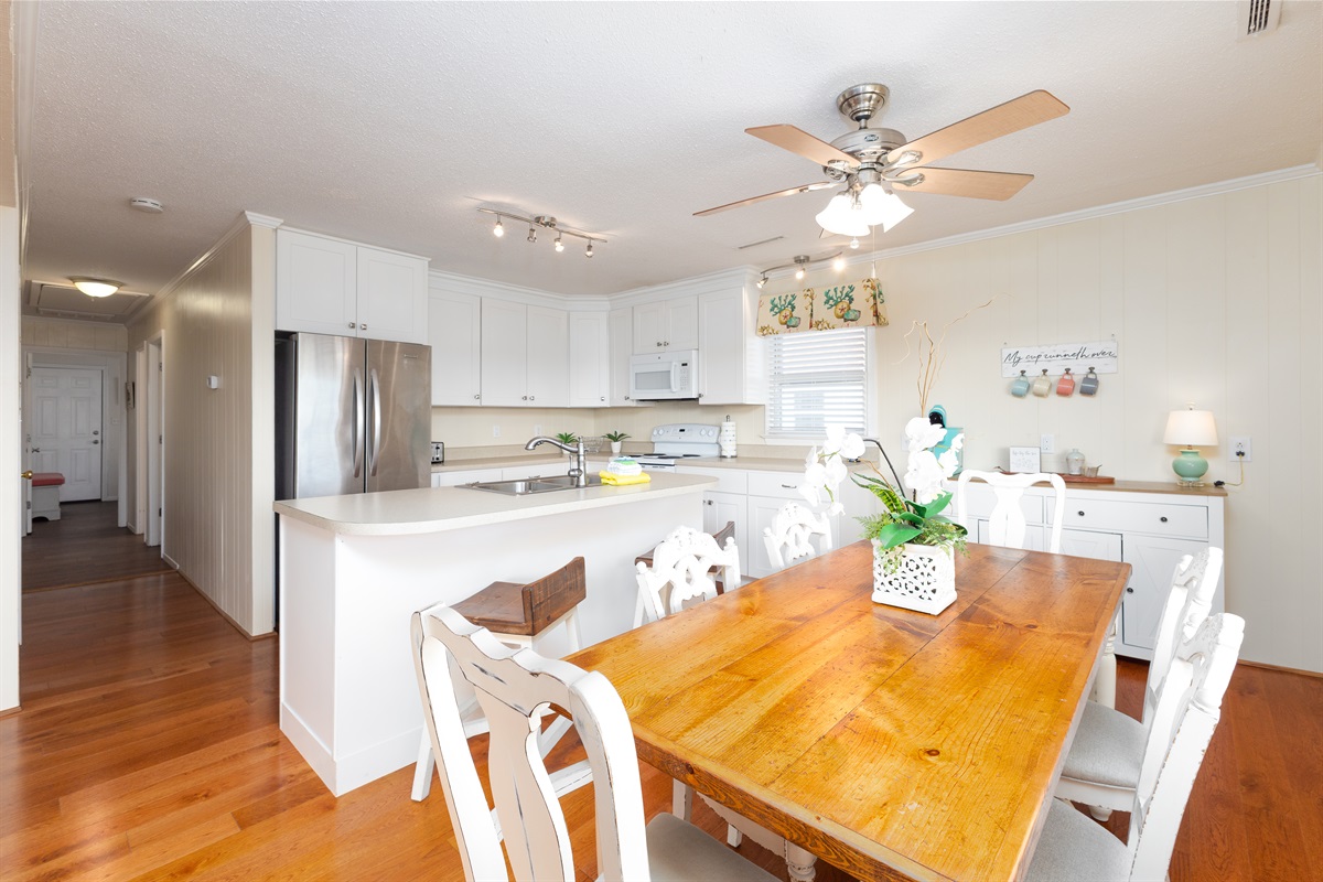 Gather around the farmhouse-style table in this open kitchen