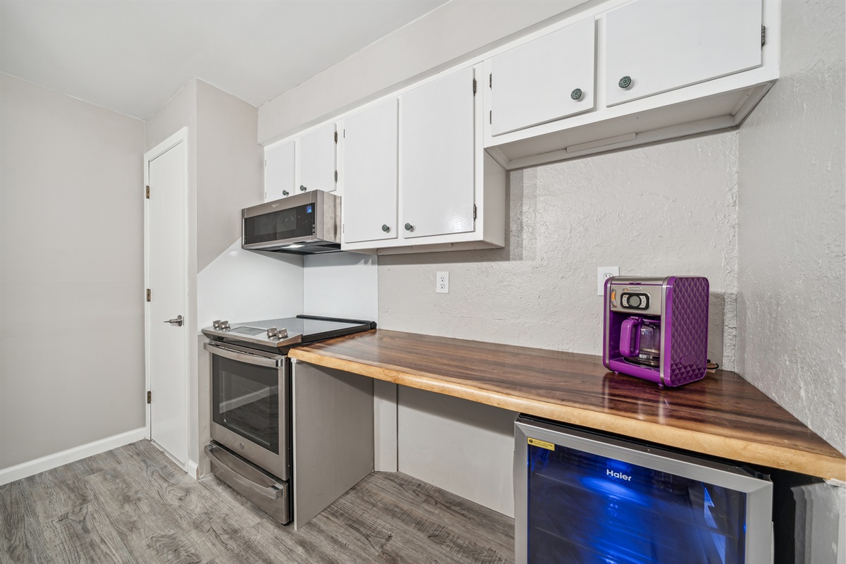 The lower kitchen features a 30 plus inch work space with 34" counter height for greater accessibility. There is an accessible mini-fridge under the counter.