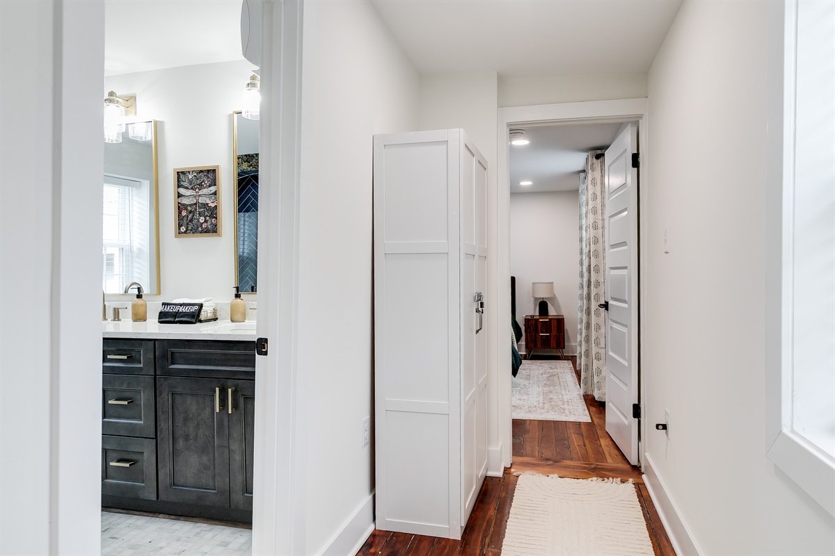 Hallway: Bright, inviting space leading to stylish accommodations and modern amenities!
