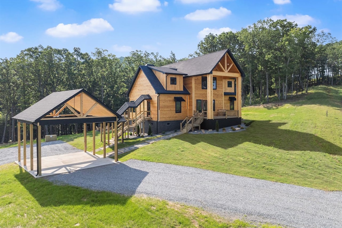Nestled on a spacious lot, this image shows off the home’s placement in peaceful, wooded surroundings.