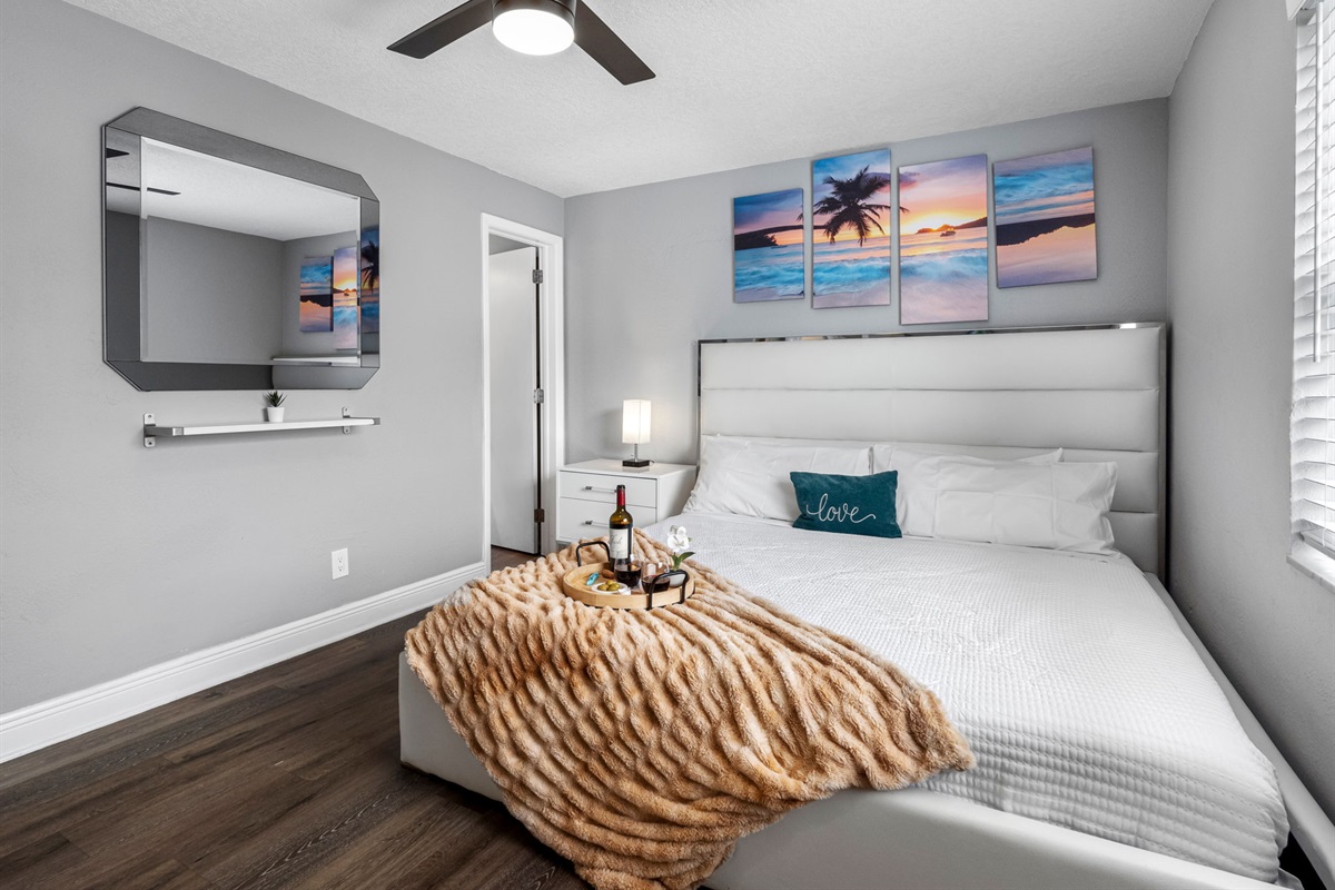This serene bedroom combines sleek modern finishes with soft textures, creating a calming retreat ideal for rest and relaxation.