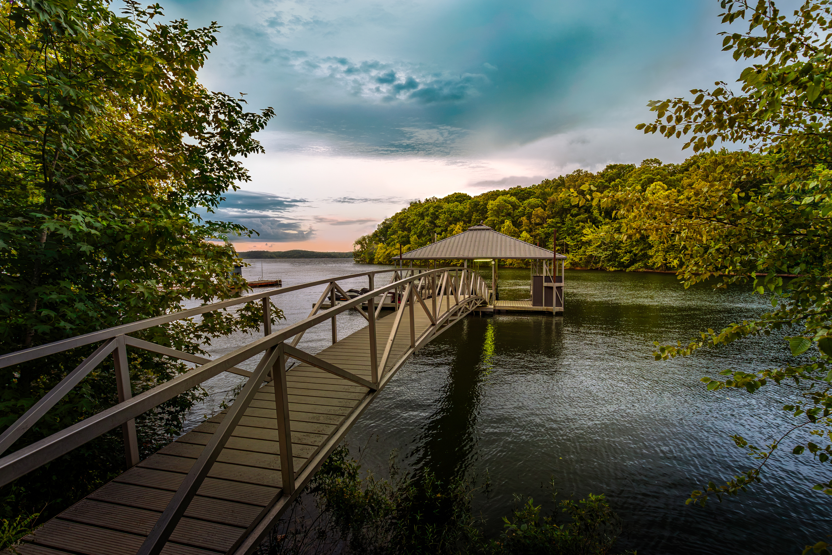 Your family’s Kentucky Lake adventure begins here—follow the walkway to your private covered dock for swimming, fishing, kayaking, and unforgettable lake days.
