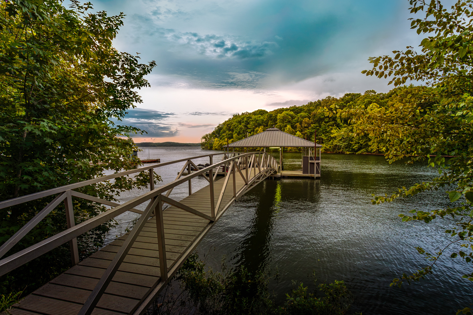 Your family’s Kentucky Lake adventure begins here—follow the walkway to your private covered dock for swimming, fishing, kayaking, and unforgettable lake days.