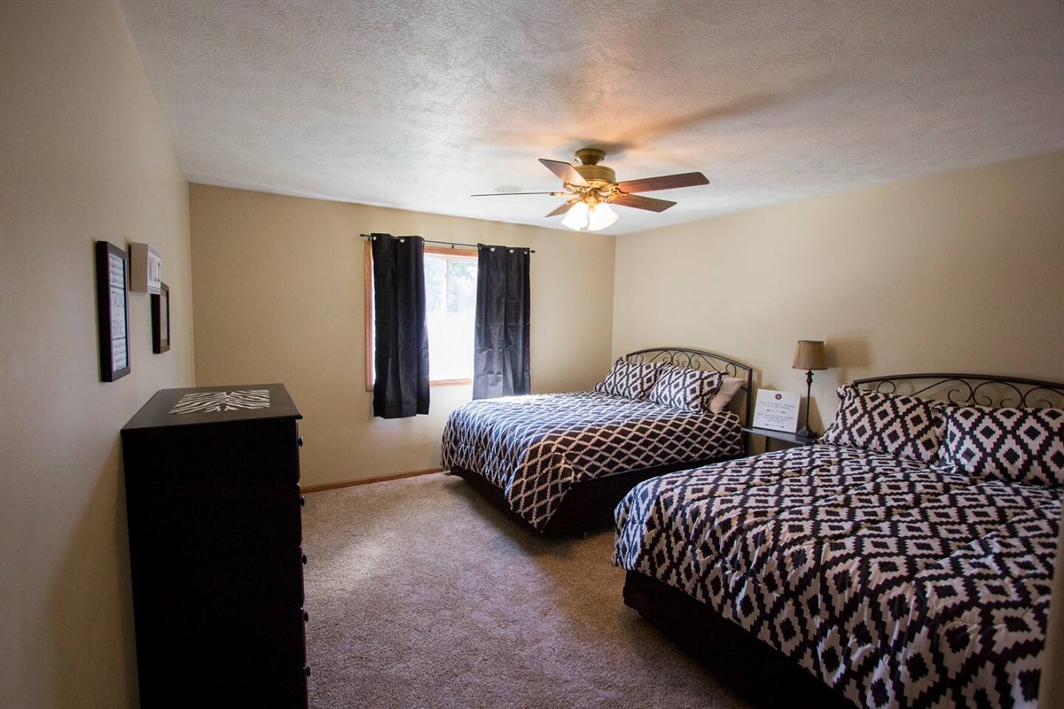 Bedroom 2 with 2 queen beds.