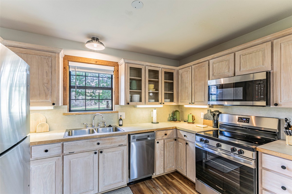 Stocked kitchen with new appliances.
