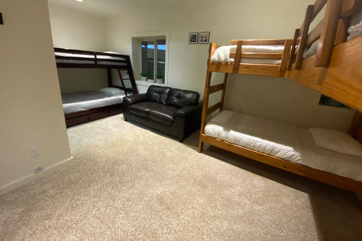 Basement bedroom with gaming couch 