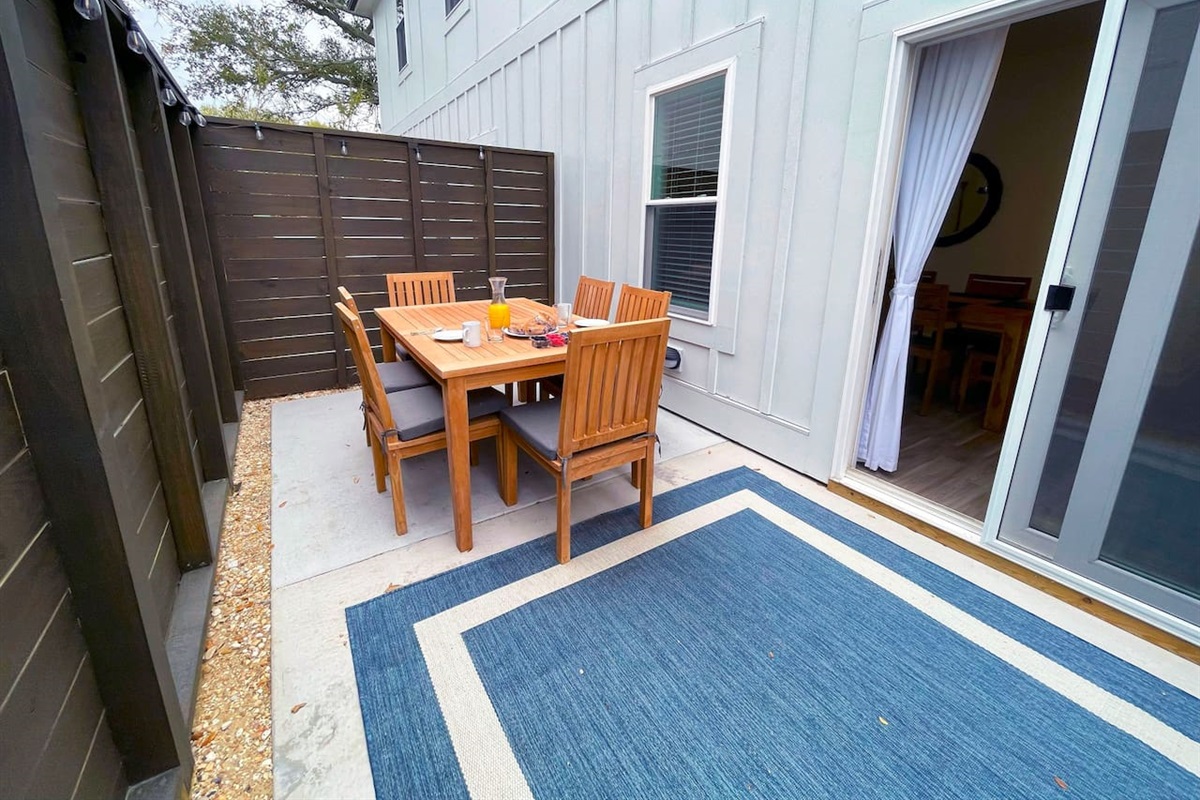 Outdoor patio with gas grill.