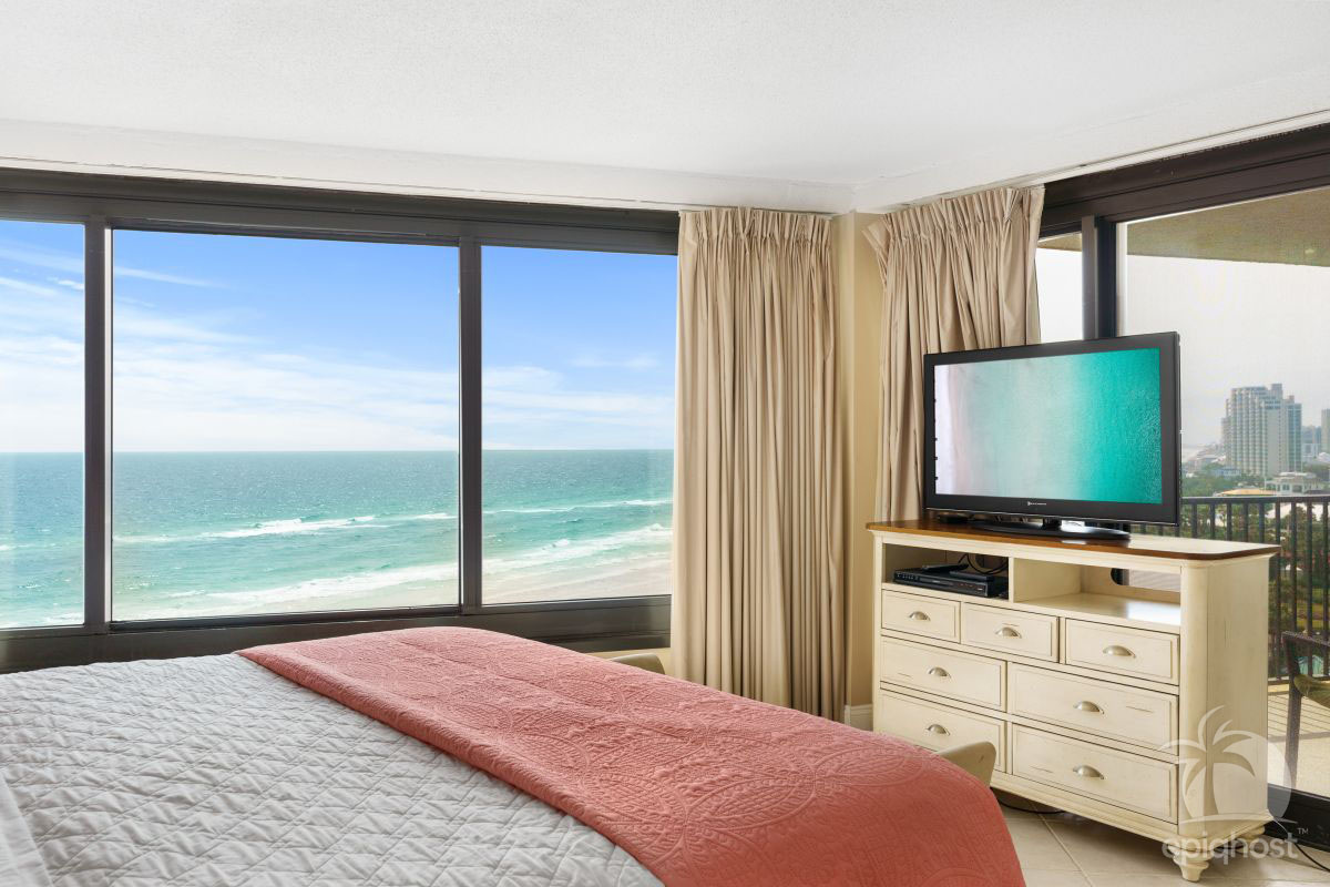 King master bedroom with HDTV and floor-to-ceiling windows