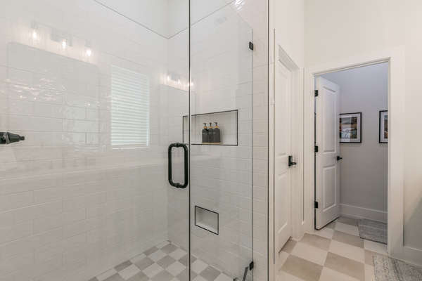 Main bathroom with double vanity and walk-in shower