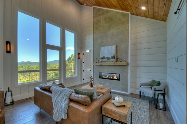 Overlooking the mountains while you sit on the leather sofa