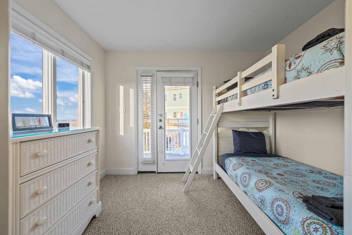 Bright bunk room with direct balcony access&mdash;great for fresh air and added convenience