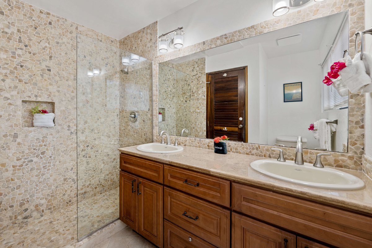 Spacious ensuite bathroom designed with comfort and convenience in mind.