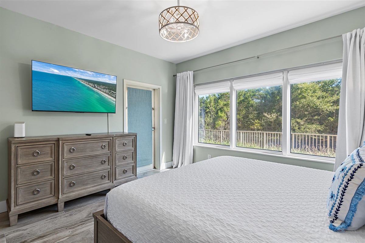 Spacious Master Bedroom with King Bed, Patio Access, Smart TV, and Private Remodeled Bathroom with Walk in Shower