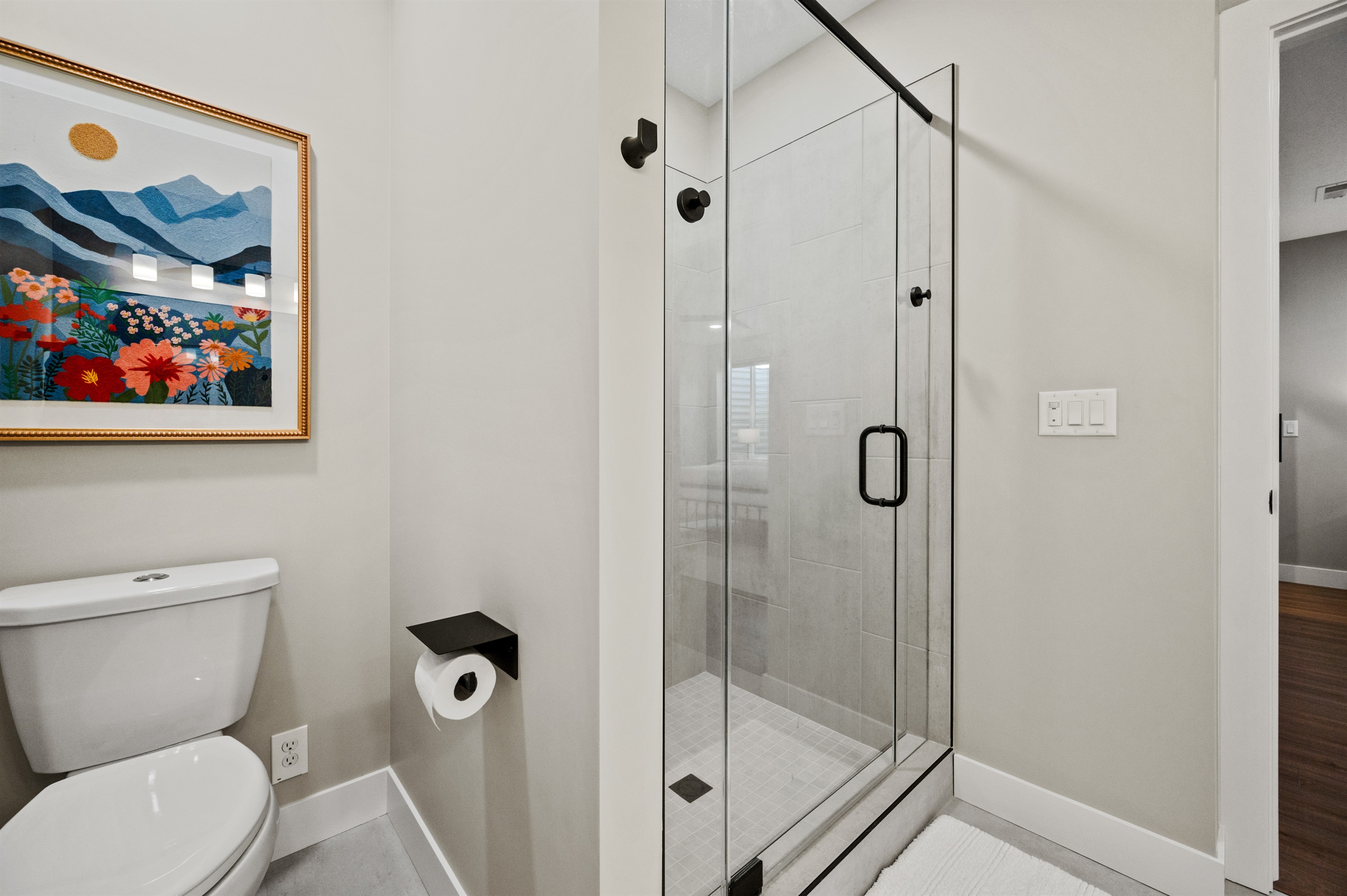 Bedroom 3 features an ensuite bathroom with a sleek glass-door shower.