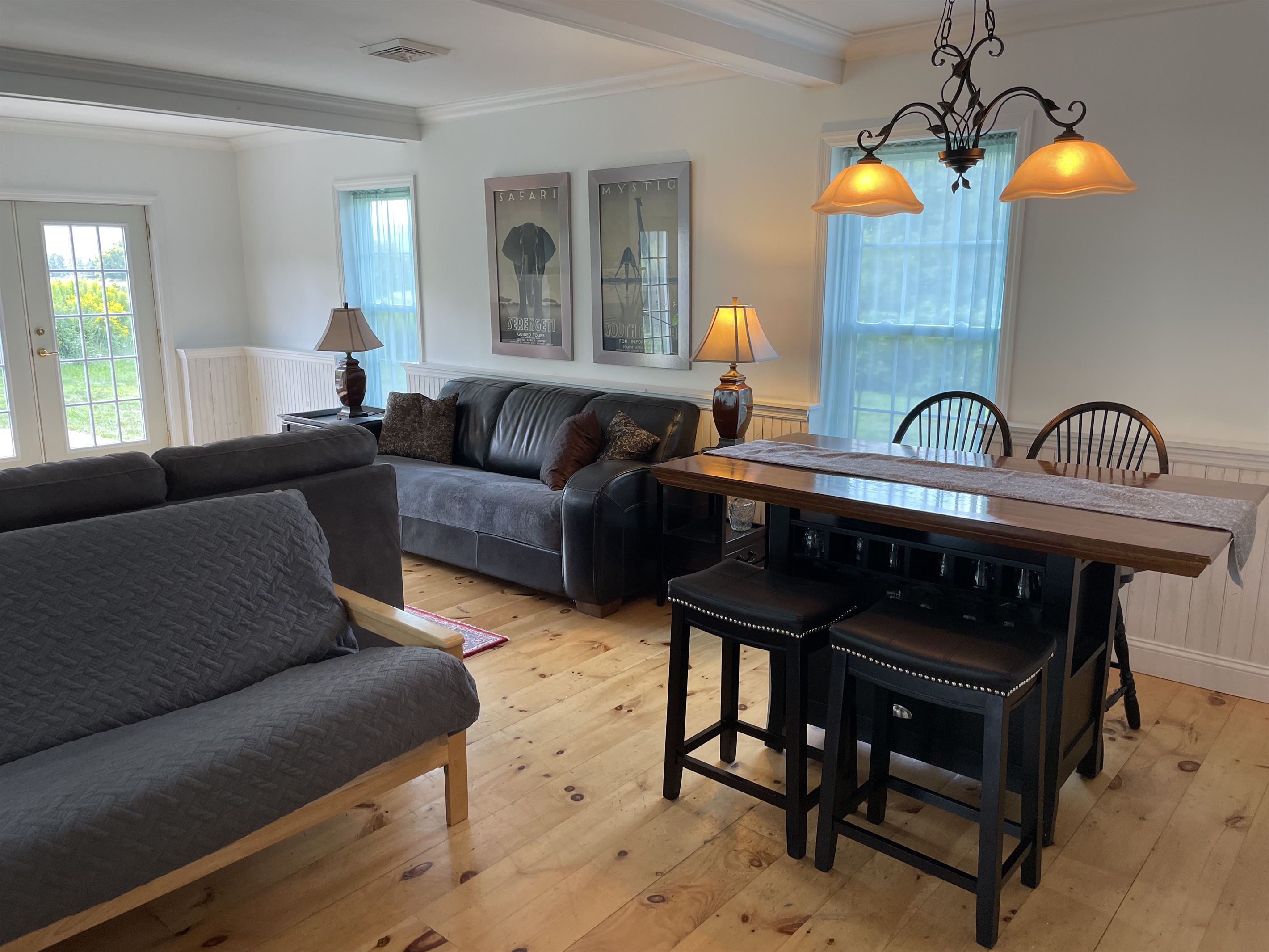 Living room with futon and bistro table