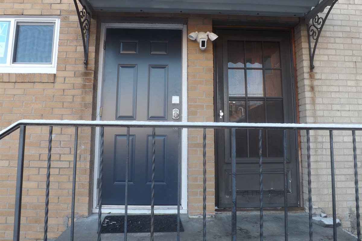 Entrance is on the side of the building. Use the door on the left.
