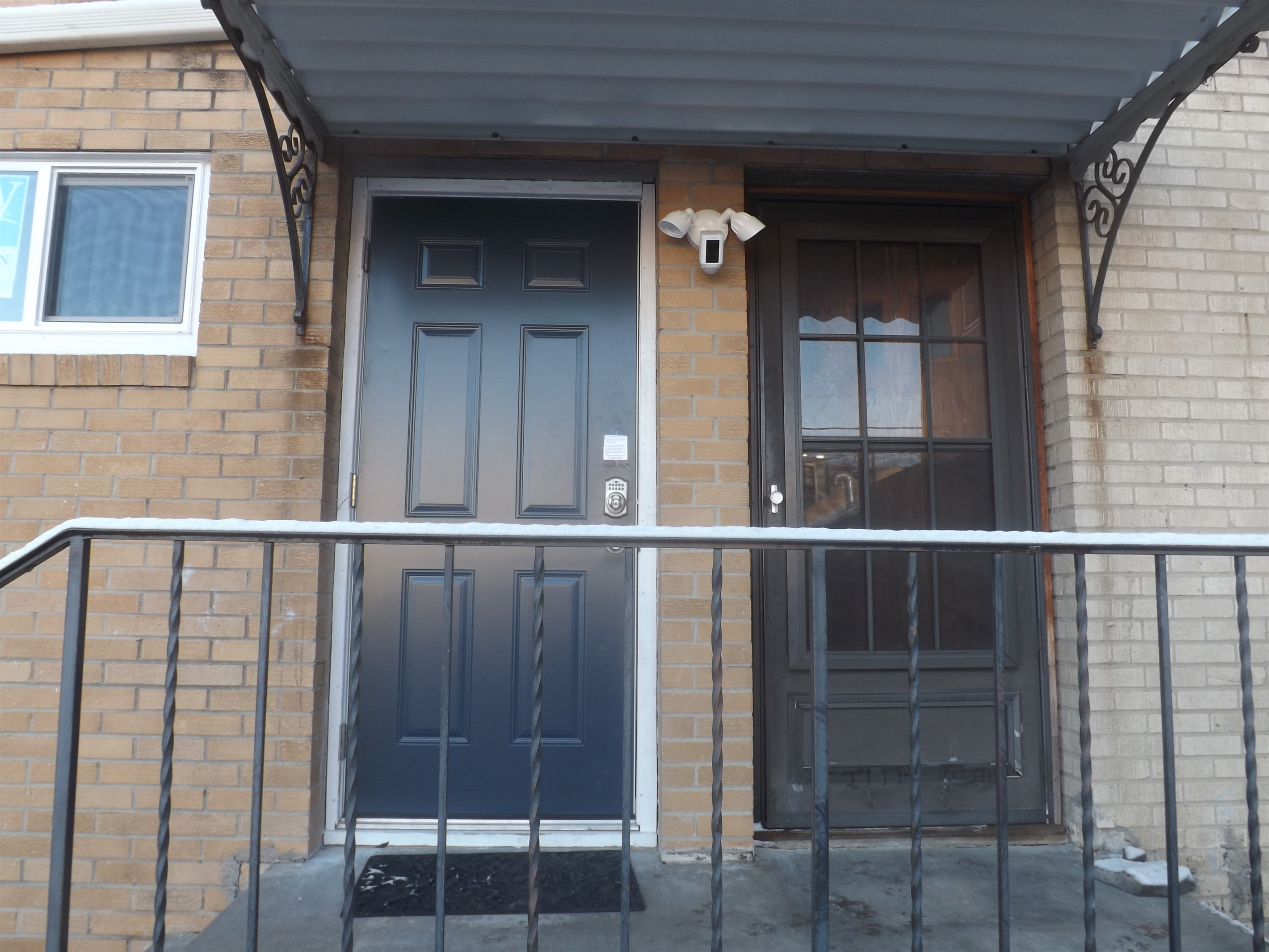 Entrance is on the side of the building. Use the door on the left.