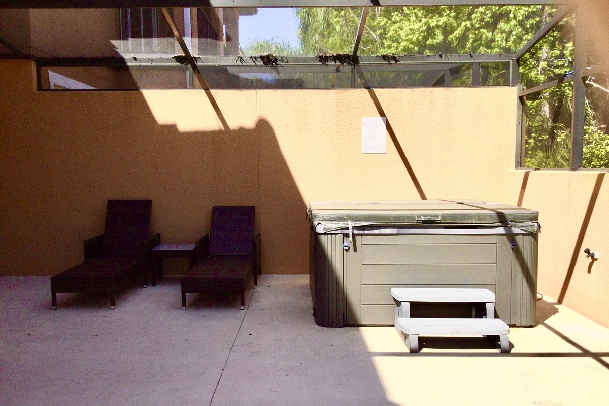 Private, covered lanai with lounge area and hot tub