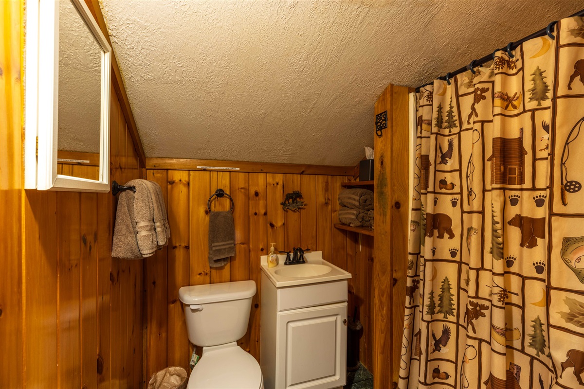 The rental's bathroom is situated upstairs within one of the bedrooms (step-in shower)