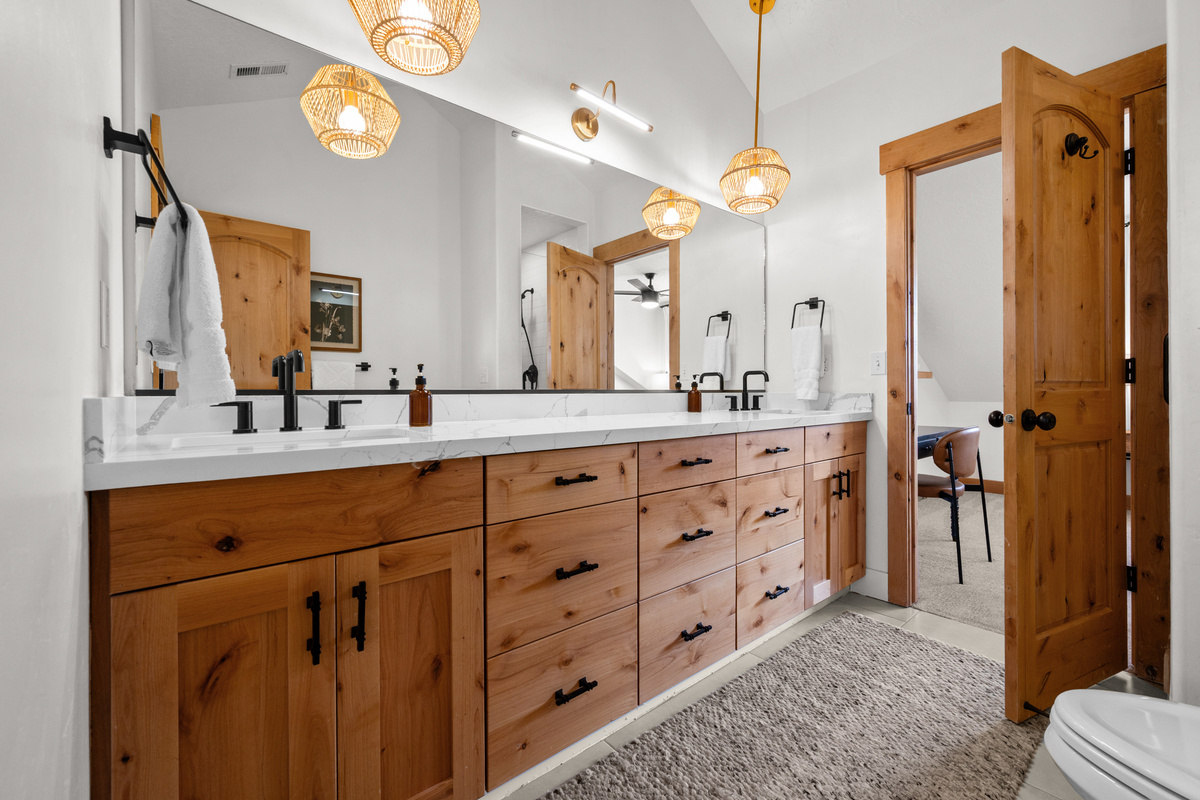 A dual-sink vanity makes the primary bathroom especially convenient for couples sharing the space.