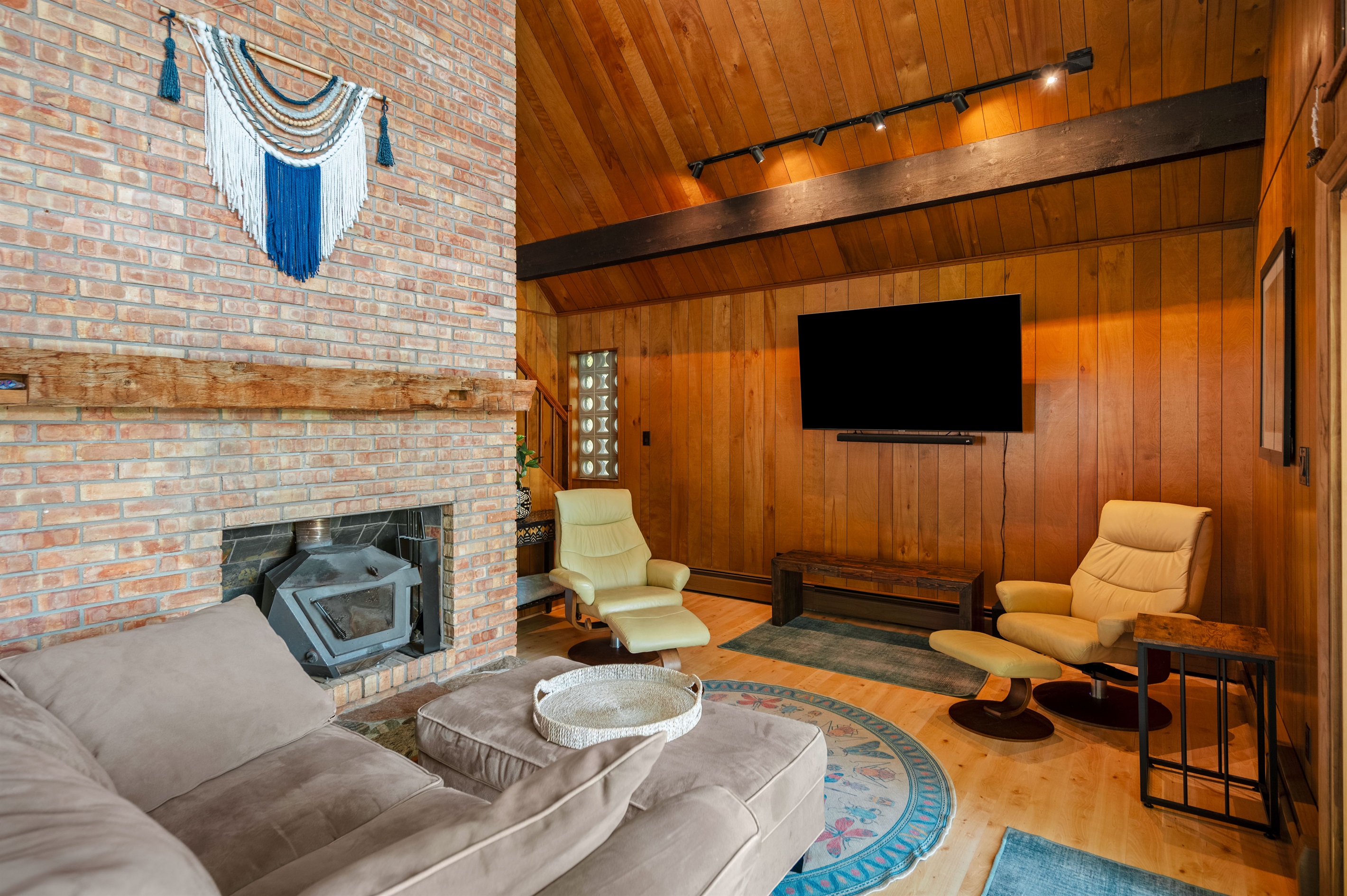 Brick fireplace and cozy seating in the main living room