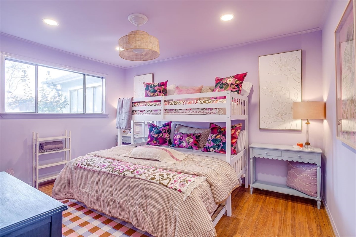 Additional guest bedroom with bold wallpaper accents