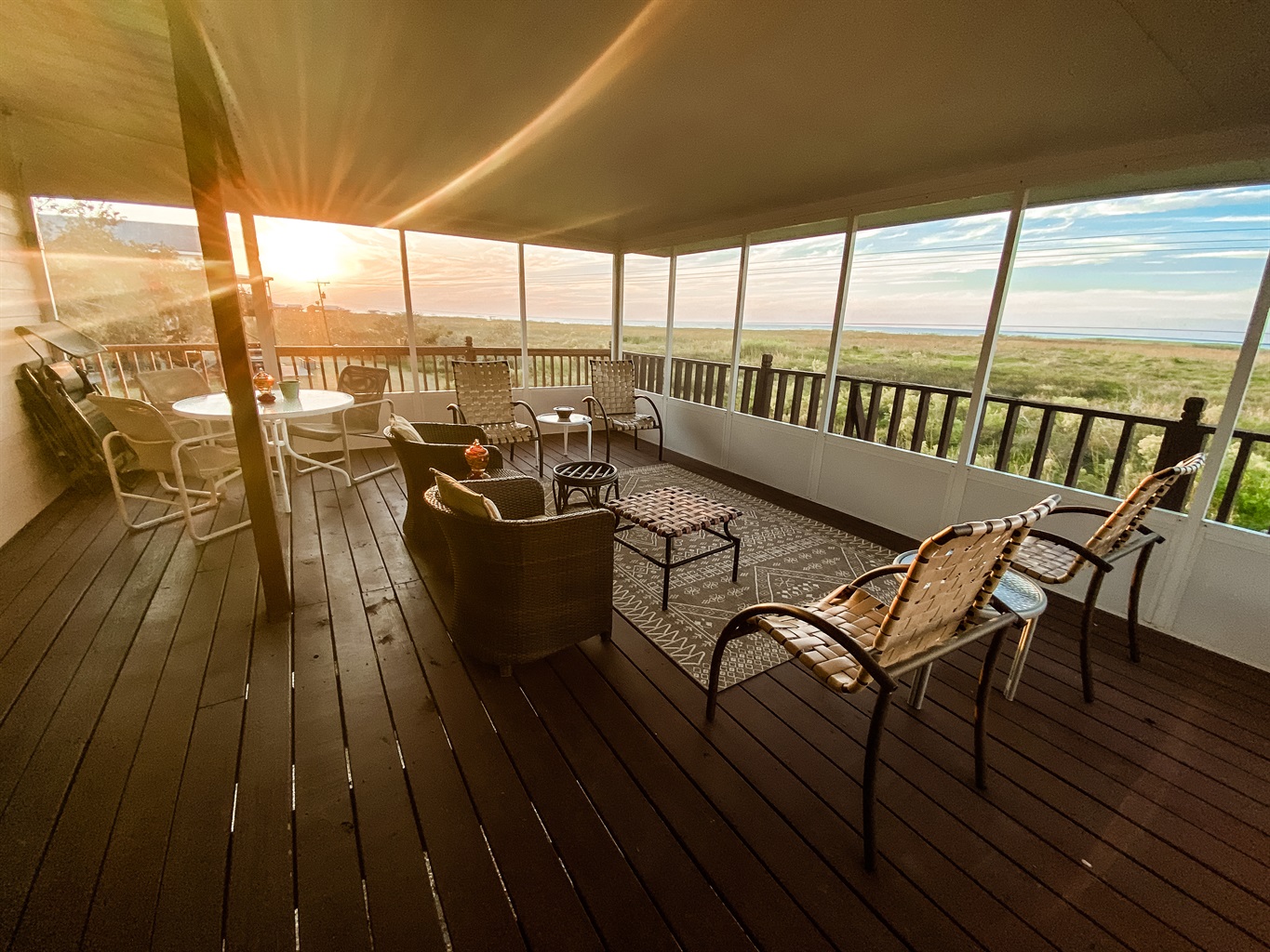 Enjoy the beautiful sunset while relaxing on the upstairs screened in back porch.