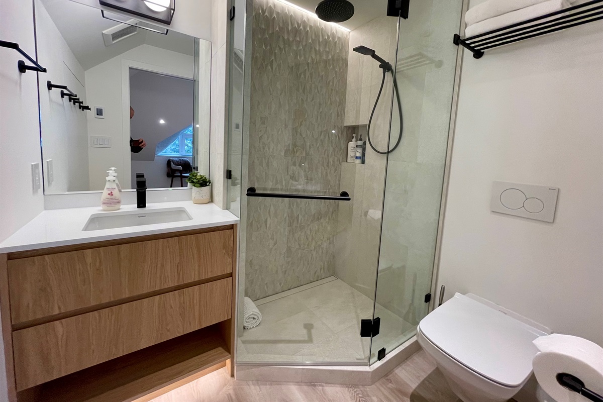 Ensuite Bathroom - Walk-In Shower, heated floor, wall hung toilet, Dimmable LED accent lighting, motion sensing under cabinet lighting 