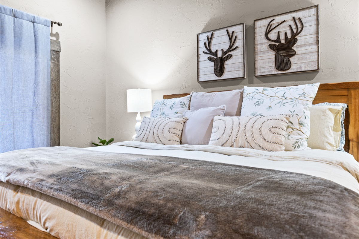 Luxurious bedding and soft lighting make this king suite an ideal sanctuary for restful nights.